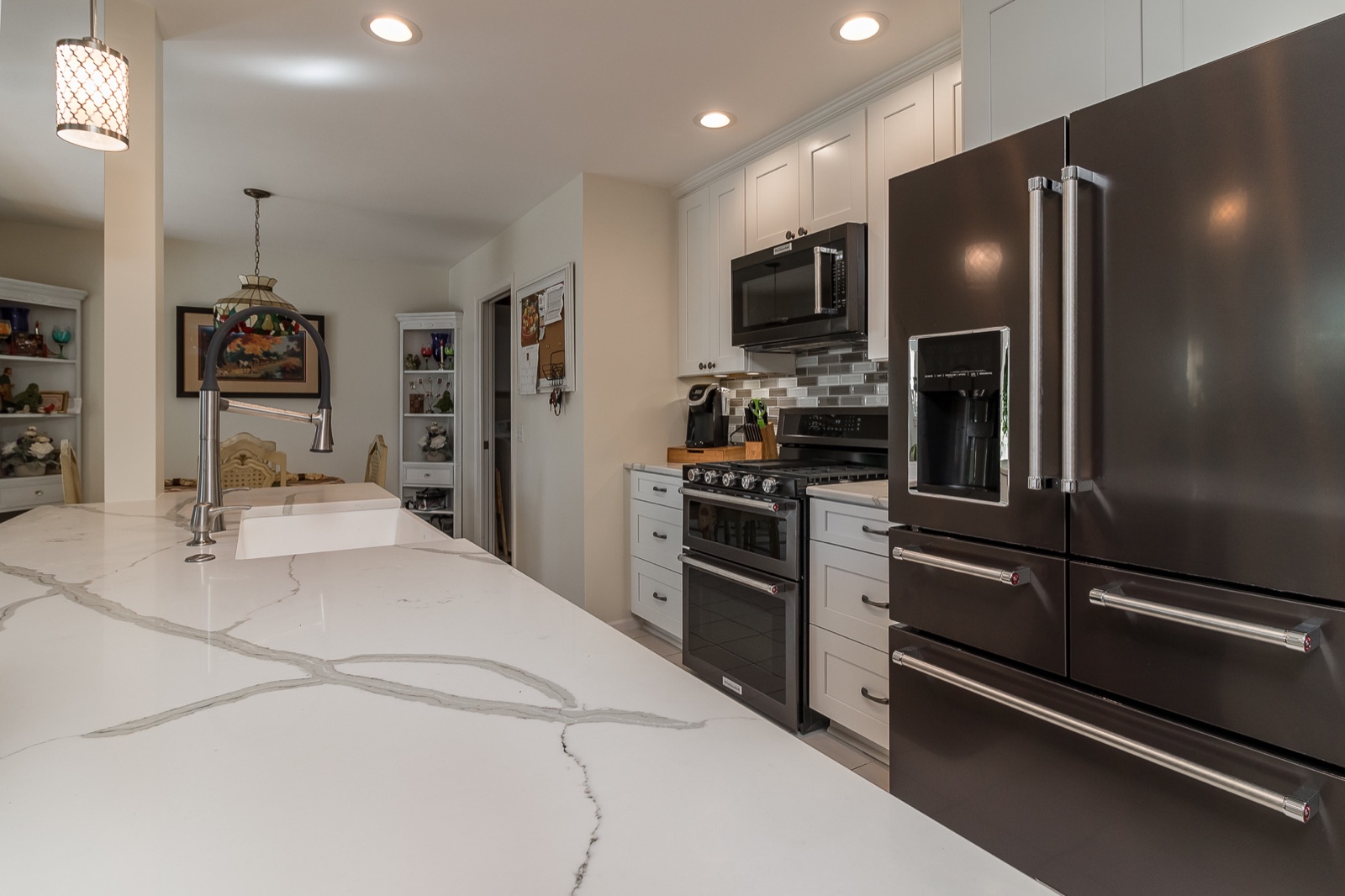 Completed Aurora kitchen renovation — Island and appliance wall