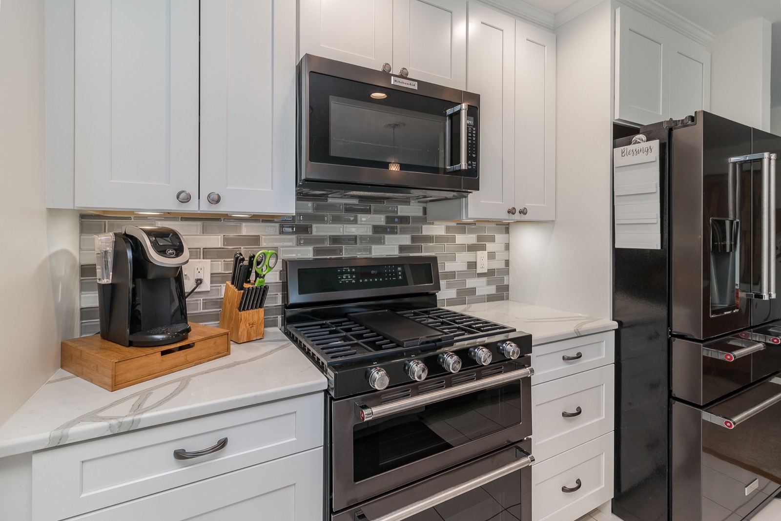 Completed Aurora kitchen renovation — Range, cabinetry, and backsplash