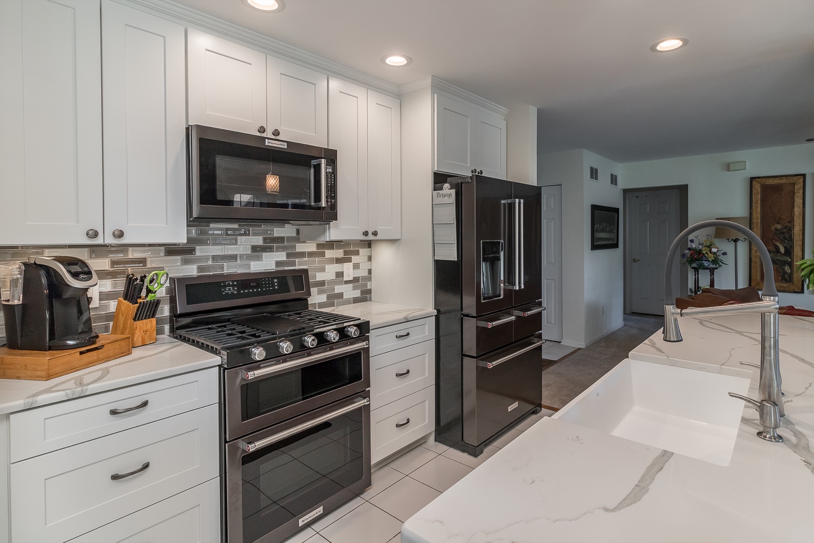 Completed Aurora kitchen renovation — Range wall and island workspace