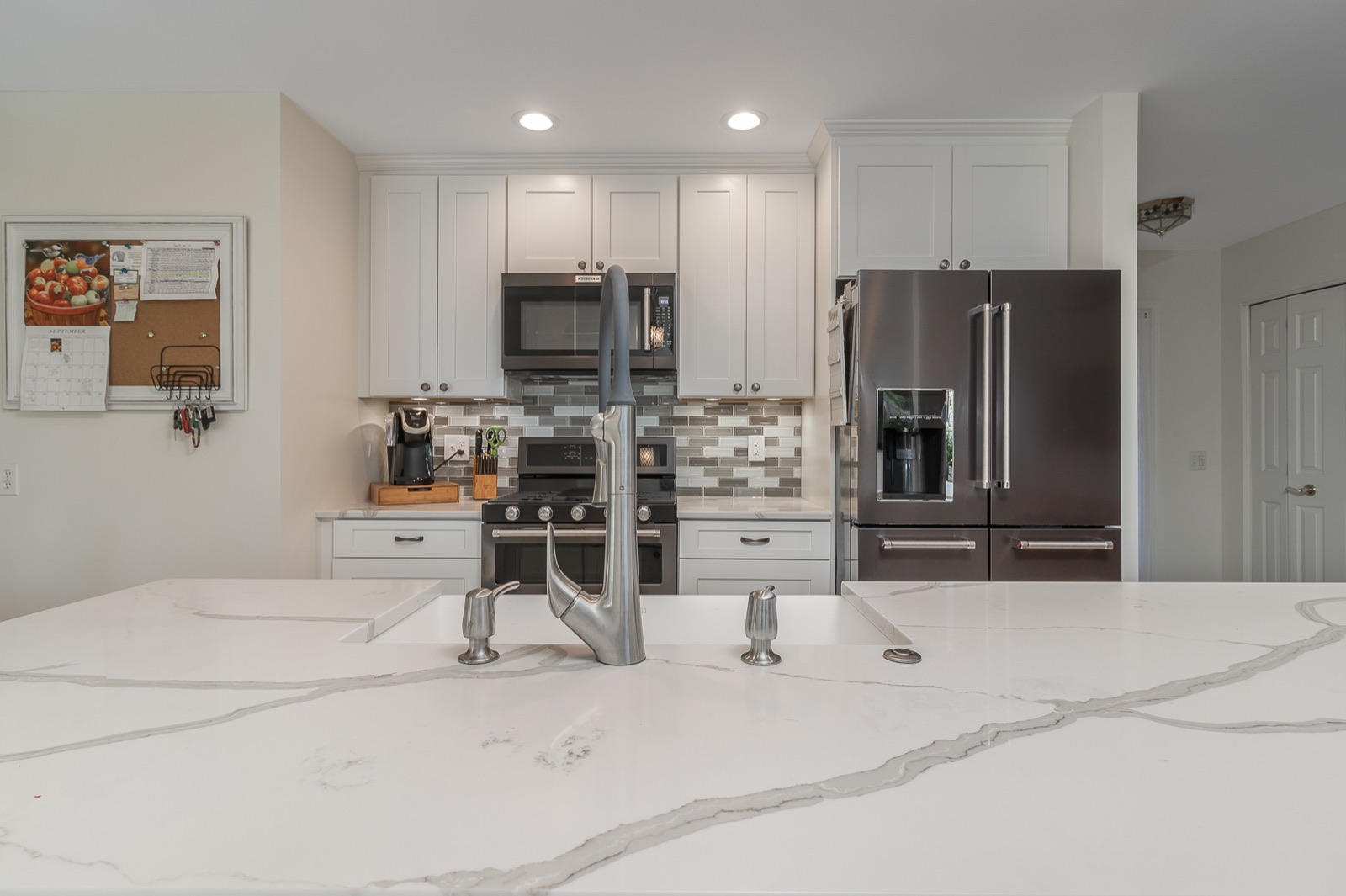 Completed Aurora kitchen renovation — Island and centered appliance wall