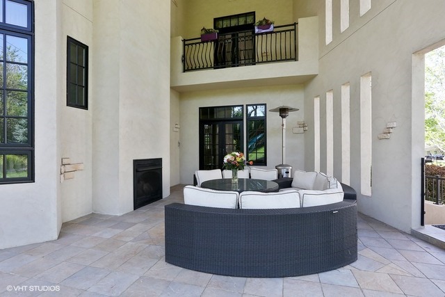 Hinsdale custom home — Covered patio and outdoor fireplace