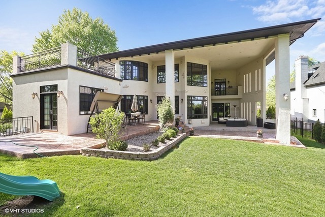 Hinsdale custom home — Backyard and two-story covered terrace