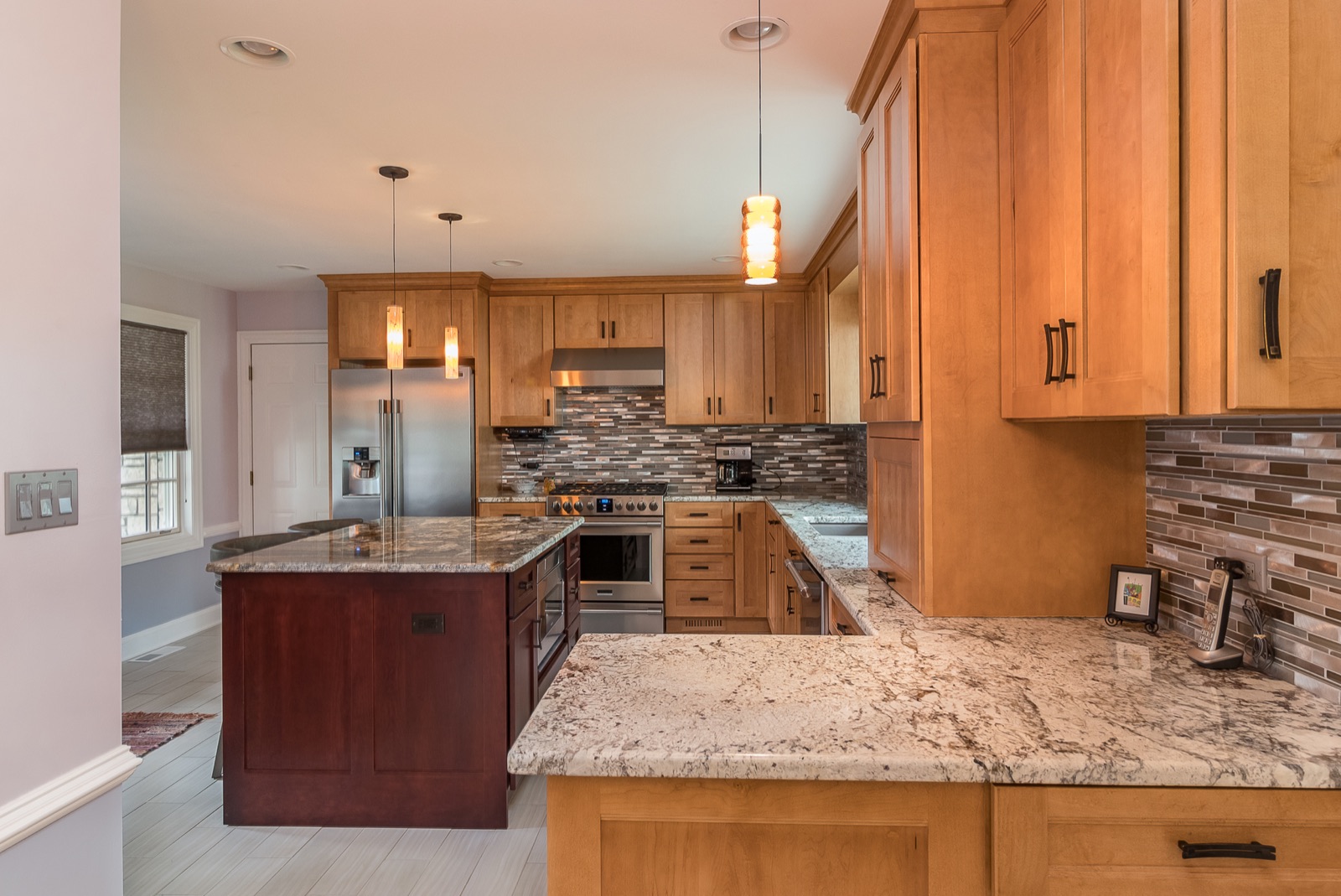 Completed Lincolnwood kitchen renovation — Layered counters and cabinetry