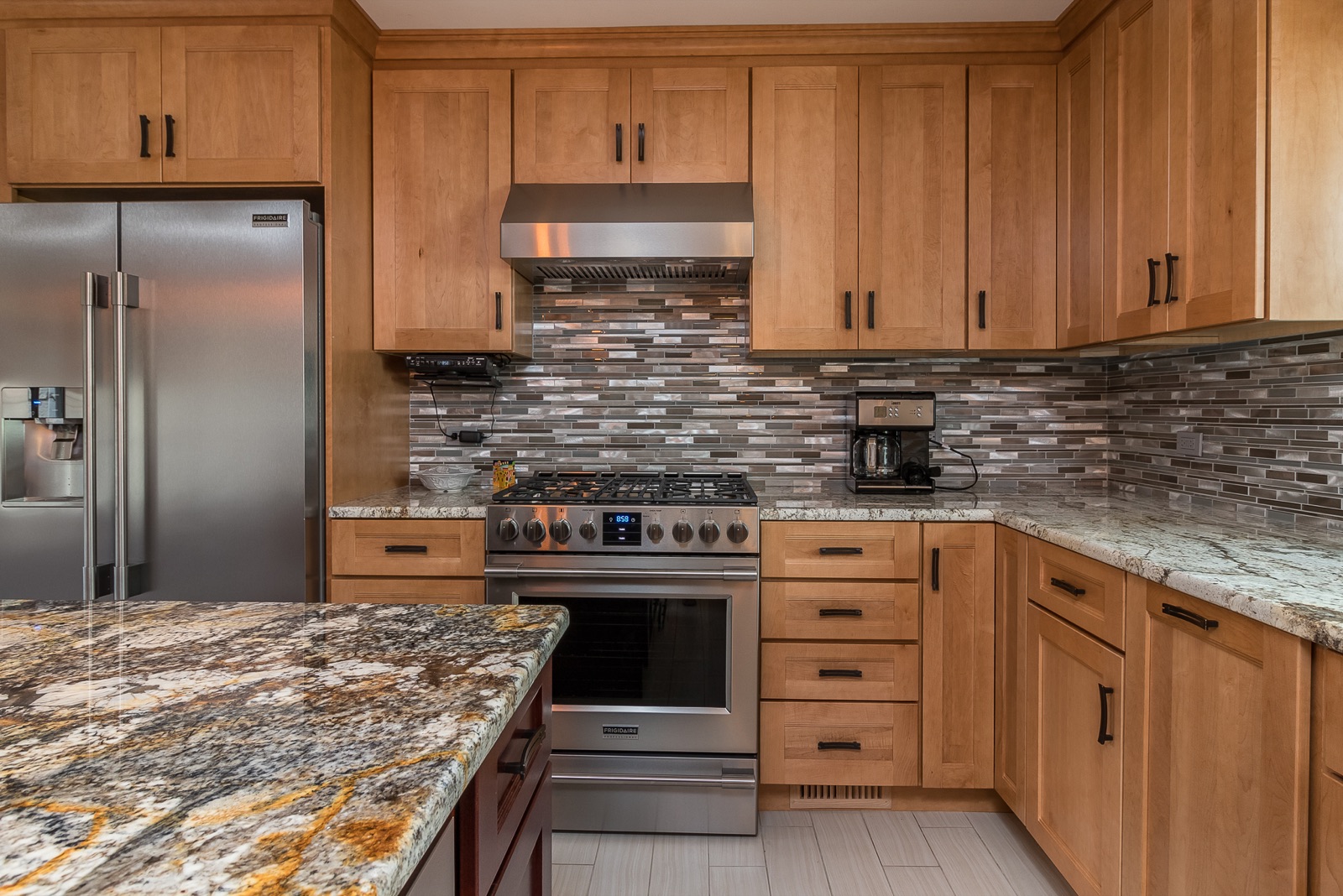 Completed Lincolnwood kitchen renovation — Professional range and backsplash