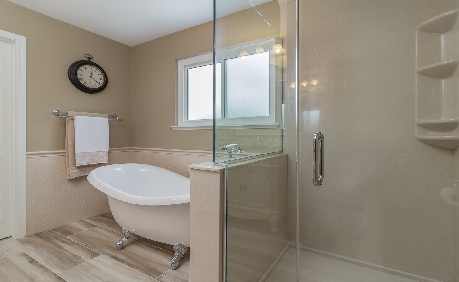 Completed Naperville master bath renovation — Vanity and freestanding tub