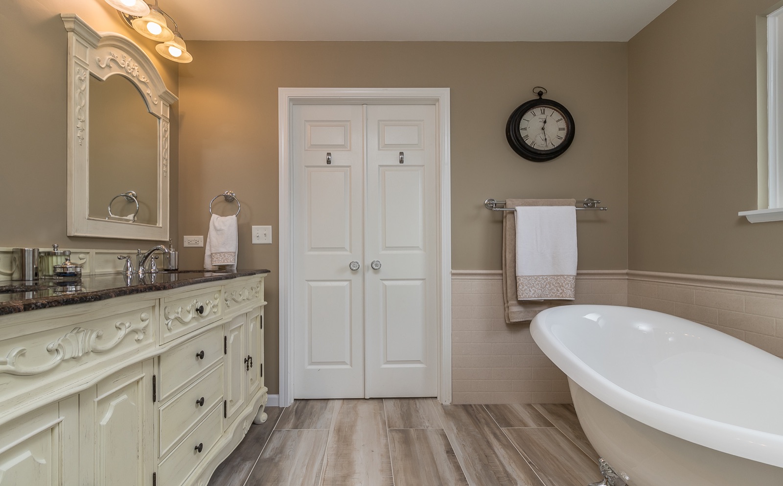 Completed Naperville master bath renovation — Clawfoot tub and glass-enclosed shower